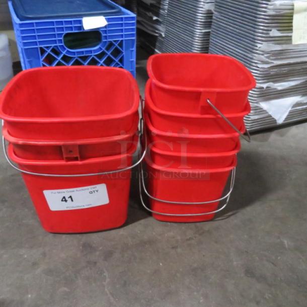 One lot of 8 assorted size red Sani buckets with metal handles, shown against industrial background. Label indicates "41 QTY."