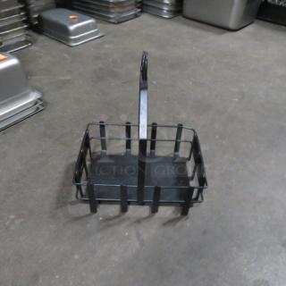 Black metal tabletop condiment holder with handle, ideal for restaurants. Sturdy construction. Good condition. Model 12XBID.