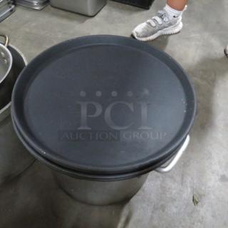 14-inch round black waitress tray, shown resting on a metal surface. Good condition, model 4XBID.