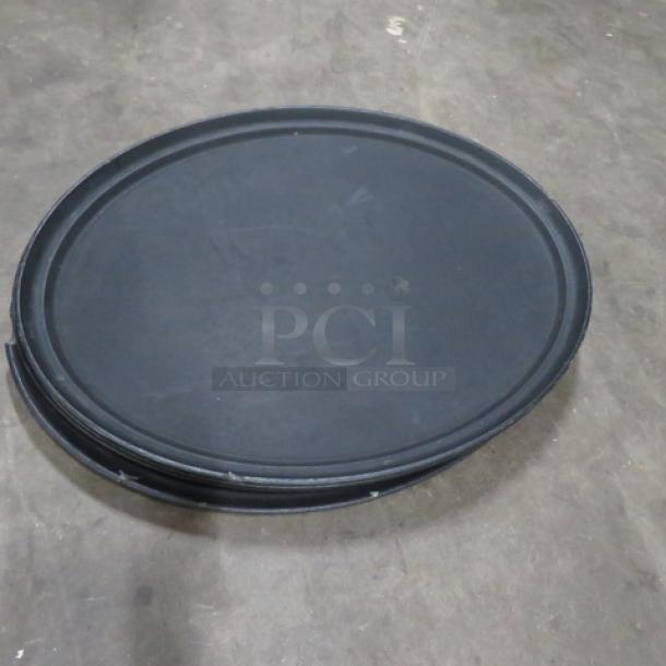 27x22 inch oval black serve tray, durable material, used condition, slight surface wear, suitable for catering or events.