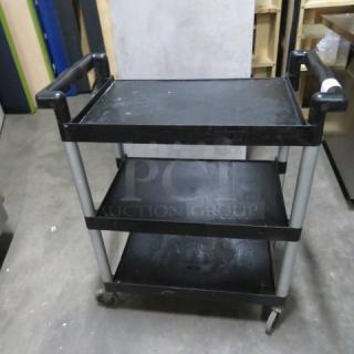 Winco Poly 3 Shelf Cart, Model UC-2415, on casters, 31x16x37 inches, black shelves, silver frame, lightly used condition.