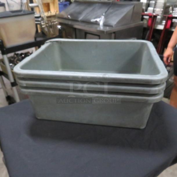 Assorted bussing tub stack, gray plastic, used condition, ideal for restaurant or catering use. Marked 3XBID.