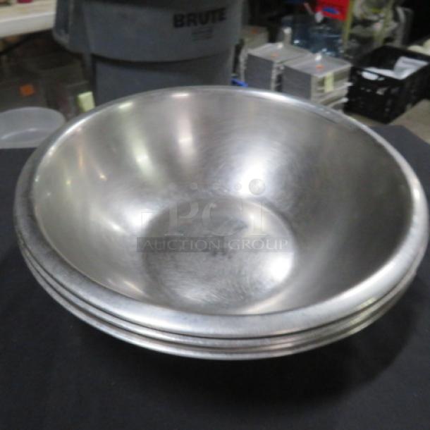 12-inch stainless steel mixing bowl, durable, with slight surface wear. Ideal for kitchen use. Model: 4XBID.