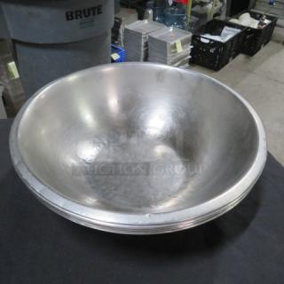 13-inch stainless steel mixing bowl, gently used, with minor surface scratches. No visible tags or markings.
