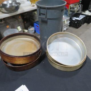10.5-inch bake pans, two stacks, mixed condition, visible wear and patina, suitable for baking or collectible use.