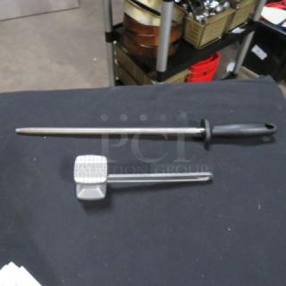 Assorted utensil set includes a meat mallet and honing steel with black handles, in good condition.