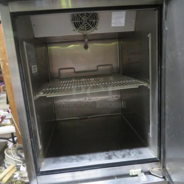 Turbo Air Dutch Door Refrigerator/Freezer, Model M3RF192-N, with 2 racks on casters; dimensions 25x32x77 inches, 115 Volt.