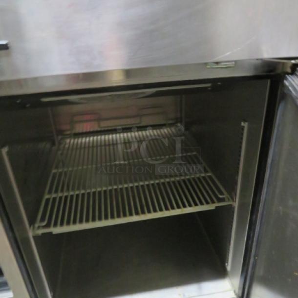 Turbo Air M3RF-192-N Dutch door refrigerator/freezer, 115V, with 2 racks, on casters, dimensions 25x32x77, working condition.