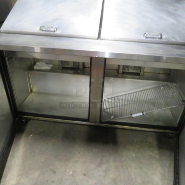 True 2-Door Refrigerated Prep Table, Model TSSU-60-24M, on casters, includes 1 rack. Dimensions: 60x34x44 inches.
