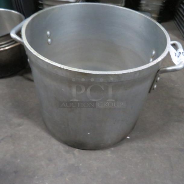 20 Quart aluminum stock pot, used condition, featuring sturdy riveted handles.
