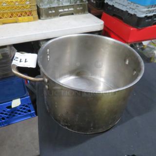 Stainless steel pot, 10x7 inches, gently used. Features sturdy handles, minor surface wear. Perfect for auction collectors.