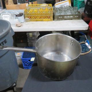 Stainless steel saucepan, 10x7 inches, used condition with sturdy handle; ideal for versatile cooking needs.