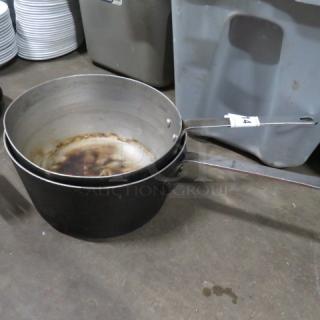 Two assorted saucepans, metal, showing signs of wear, with numeric label "74" on handle, auction item 2XBID.