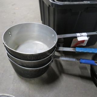 Assorted sauce pans, stack of three, stainless exterior, blue grip handles, fair condition, labeled "3XBID".