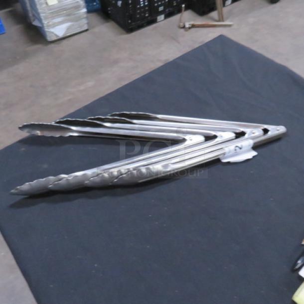 12-inch stainless steel tongs with scalloped edges. Model 5XBID. Appears in excellent condition.