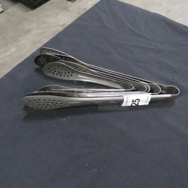 Assorted stainless steel tongs, set of five, perforated design, gently used. Auction tag reads "25" for lot identification.
