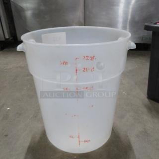 Clear round 22-quart food storage container, marked in red increments, handles on sides, in good condition.