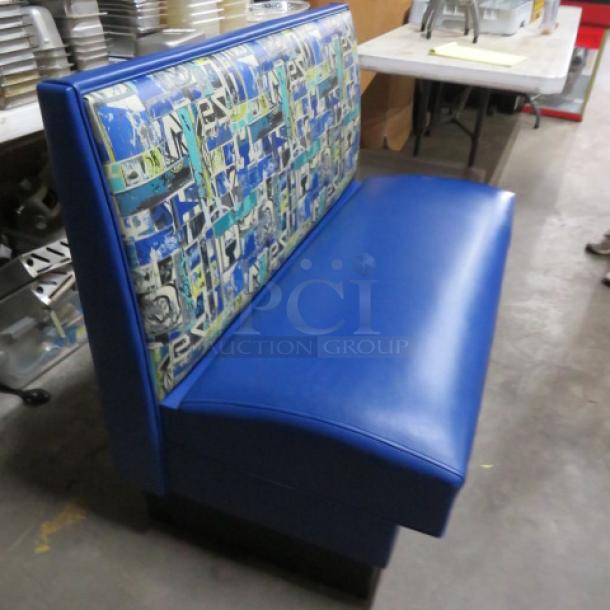 Single sided booth with cushioned seat and patterned backrest, blue upholstery, dimensions 48x25x36 inches, excellent condition.