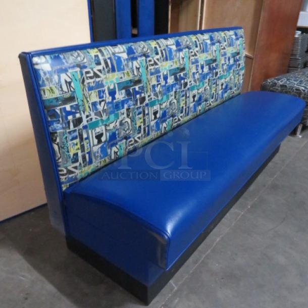 Single-sided booth with cushioned seat and back, blue upholstery, colorful pattern, measures 72x25x36 inches, good condition.