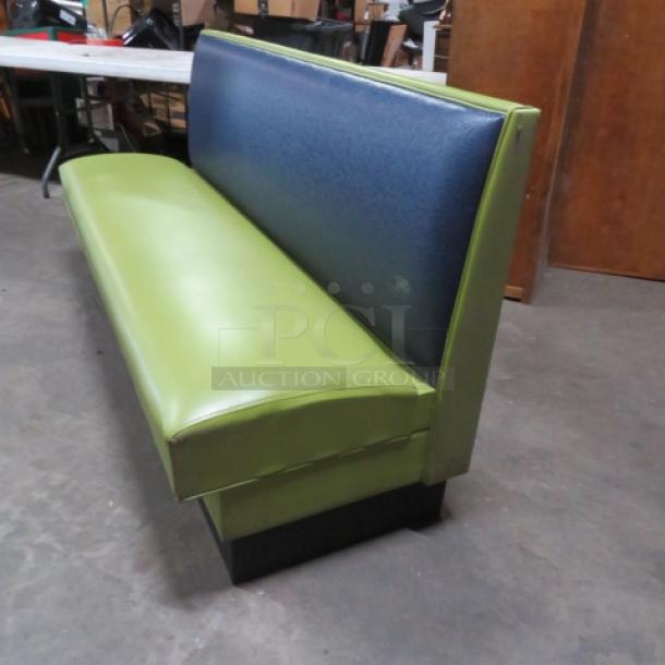 Single-sided booth with green cushioned seat and navy backrest, dimensions 72x25x36, in good condition.