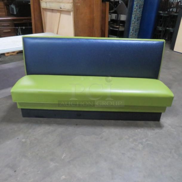 Single-sided booth with cushioned seat and back, green and blue upholstery, 72x25x36 inches, good condition.