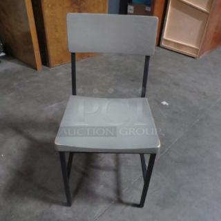 Black metal chair with gray wooden seat and back, model 4XBID, in good condition.