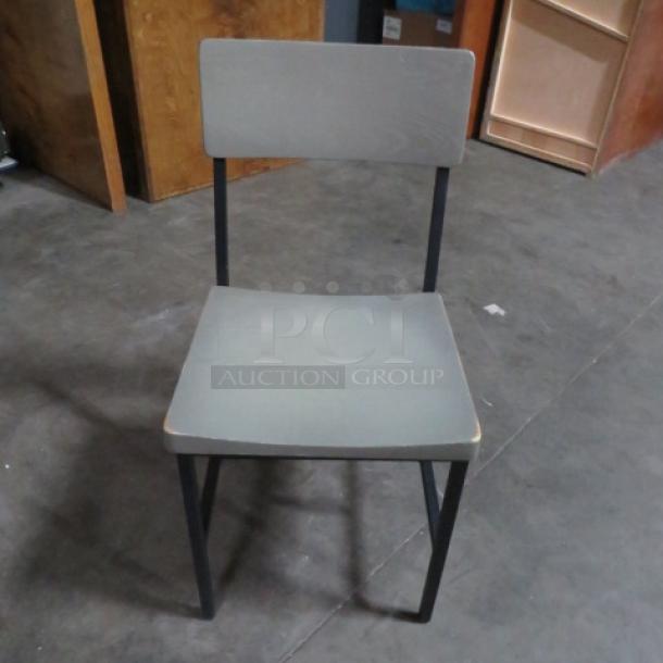 Black metal chair with gray wooden seat and back, model 4XBID, in good condition.