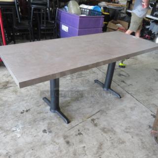 Gray table top on dual pedestal bases, 72x30x30 inches, sturdy condition, ideal for office or dining space.