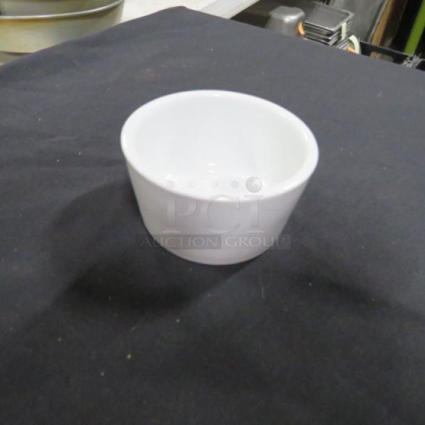 Lot of 25 CAC ramekins, 3.5x2 inches, white ceramic, new condition, ideal for serving desserts or sauces.