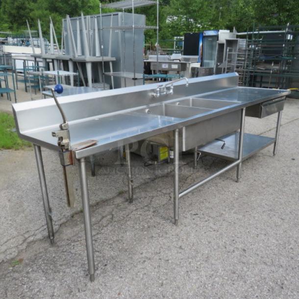 Stainless steel 2-compartment sink with faucet, R/L drain tables, Edlund 10lb can opener, stainless drawer, backsplash, under shelf. 120x30x42. Sink 24x18x10.