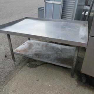 Stainless steel equipment table with undershelf, 48x30x26 inches, used condition, visible wear on shelf.
