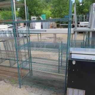 Green coated Metro shelf with four adjustable shelves, 42x24x73.5 inches. Used condition. Suitable for storage.