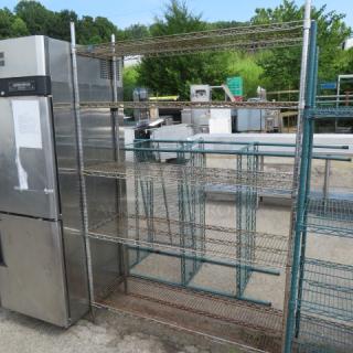Metro shelving unit, 54x18x79 inches, five adjustable wire shelves, metal construction, used condition, outdoor setting.