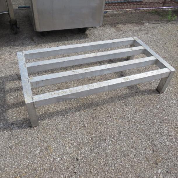Aluminum dunnage rack, 36x18x8 inches, sturdy construction, four slats, used condition. Ideal for storage.