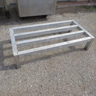 Aluminum dunnage rack, 36x18x8 inches, sturdy construction, four slats, used condition. Ideal for storage.