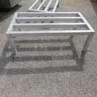 Aluminum dunnage rack, size 36x20x12 inches, featuring a slatted top and sturdy legs. Suitable for storage, used condition.