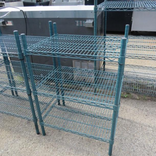 Metro green shelf with 3 wire shelves, 24x18x35 inches. Sturdy construction, ideal for storage. Slight wear visible.
