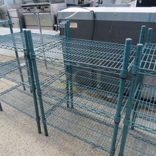 One green Metro shelf unit with three shelves, size 24x18x35 inches, made of sturdy metal, in good condition.
