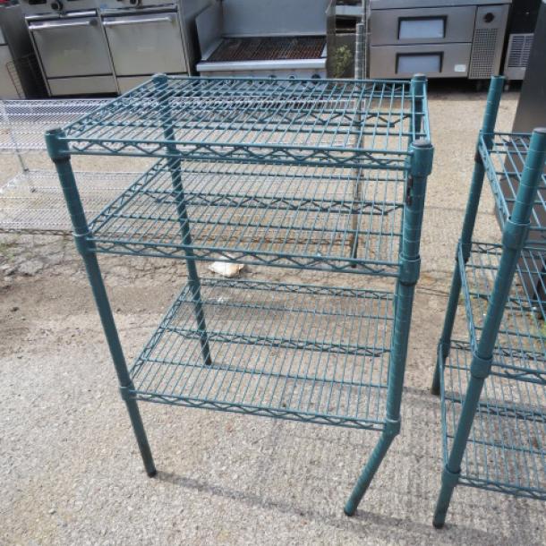 Green Metro shelf with three wire shelves, 24x18x35 inches. Durable metal frame, suitable for storage, good condition.