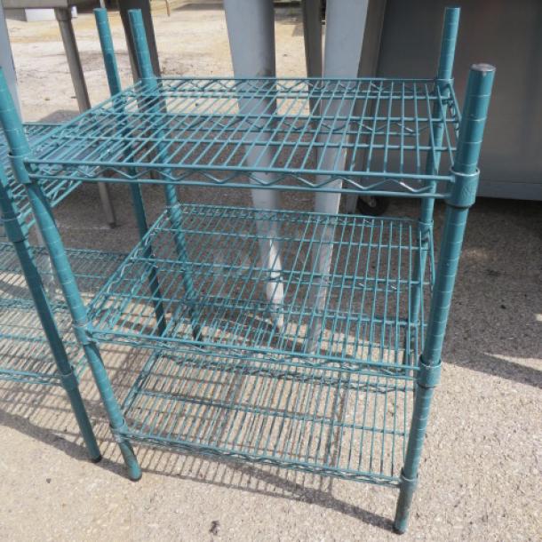 Green Metro shelf with three wire shelves, 24x18x35 inches. Sturdy metal construction, excellent for storage or organization.