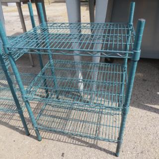 Green Metro shelf with three wire shelves, 24x18x35 inches. Sturdy metal construction, excellent for storage or organization.