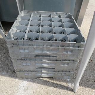 Gray dishwasher rack with 25 holes, model 3XBID. Sturdy plastic construction; used condition. Suitable for commercial use.