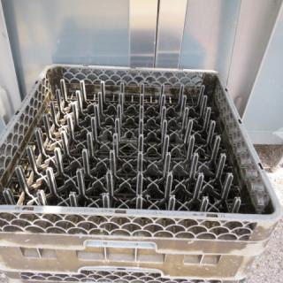 Gray dishwasher rack, model 3XBID, in good condition. Features sturdy design with evenly spaced prongs for optimal dish placement.