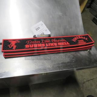 Fireball bar mat featuring red logo and slogan "Tastes Like Heaven, Burns Like Hell," in good condition.