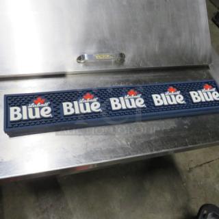 Labatt Blue bar mat featuring logo and maple leaf design, in good condition, on stainless steel surface.