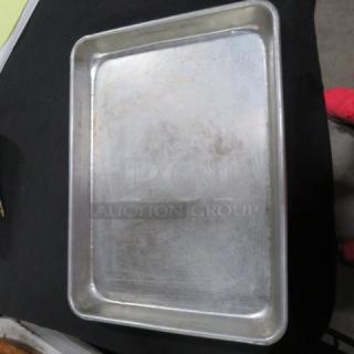 One lot of 50 aluminum sheet pans, size 13x9.5 inches, used with surface scratches, ideal for baking needs.