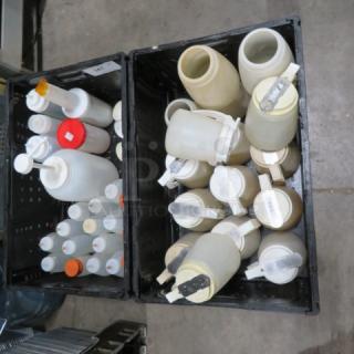 Large lot of assorted plastic containers and dispensers, includes bottles with pumps and caps, in good condition.