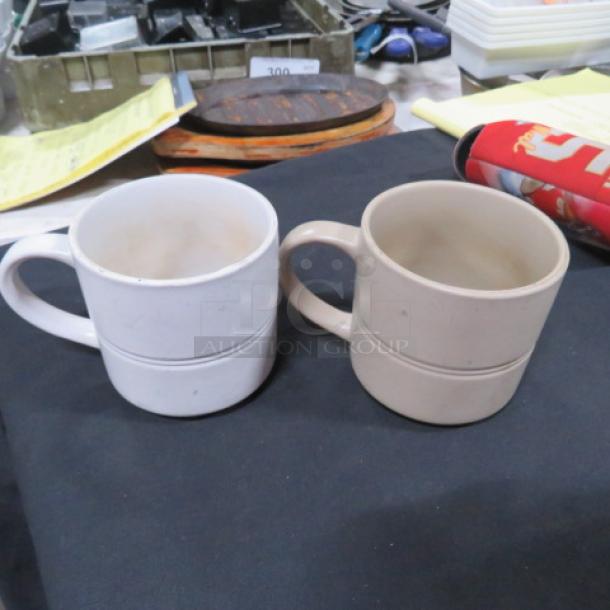 One Mega Lot of 36 coffee mugs: 31 brown and 5 white, assorted design, gently used condition.