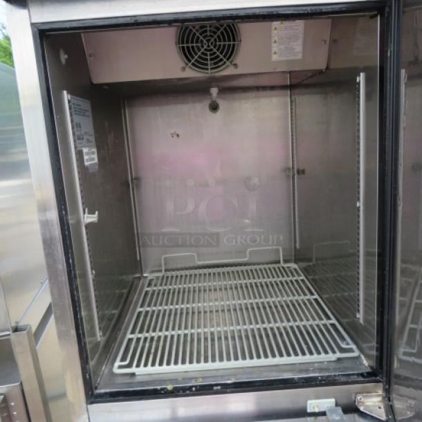 Turbo Air Dutch Door Refrigerator/Freezer, Model M3RF192-N, 25x32x77, 115 Volt, with 2 racks, on casters, excellent condition.