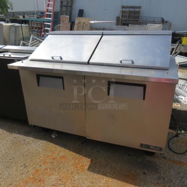 True 2-door refrigerated prep table, Model TSSU-60-24M-B-ST-HC, on casters, 60x34x48 inches, stainless steel, 115V.